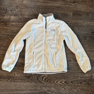 White fuzzy North Face jacket